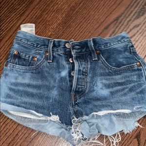 Levi jean shorts with tie dye detail on the back